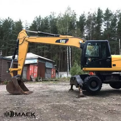 Caterpillar M315D с планировочным ковшом